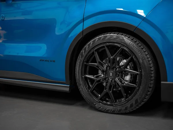 side of a Digital Blue Ford Transit Custom with an Apache bodykit