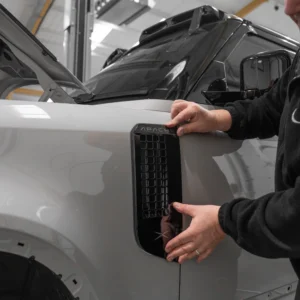 An Apache side vent being fitted to a Borasco Grey Defender 90