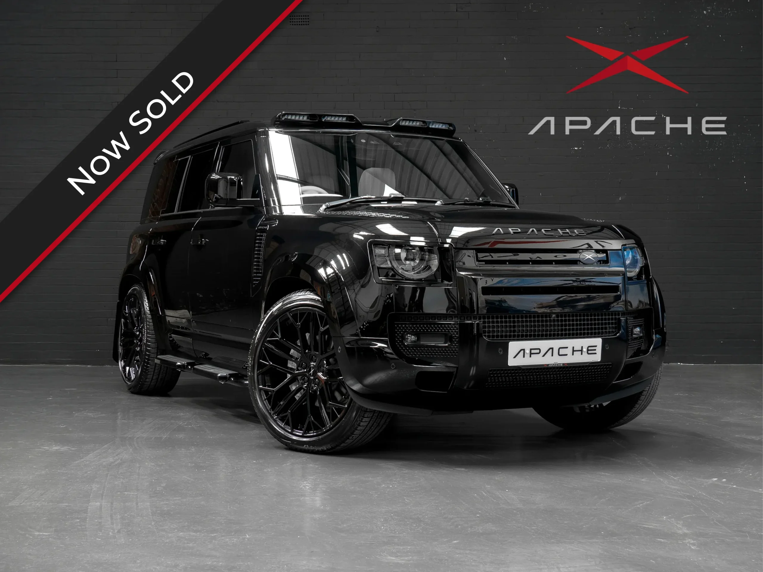 Front corner of a Land Rover Defender 110 with an Apache bodykit